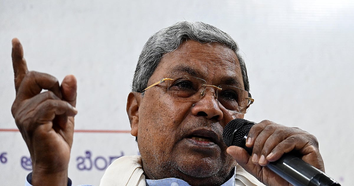File photograph of Siddaramaiah speaking into a microphone